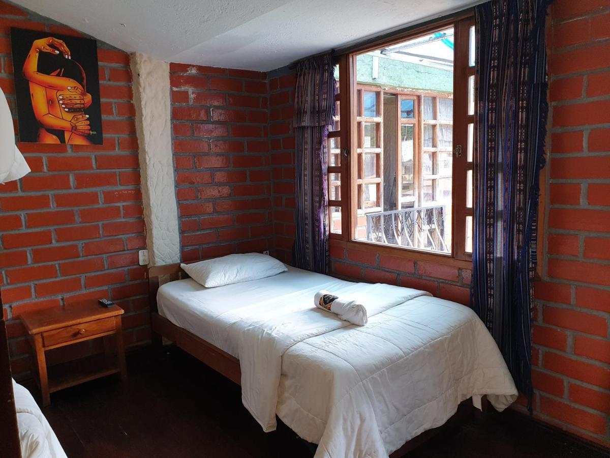 Hostal Inti Raymi Backpackers บาญอส ภายนอก รูปภาพ
